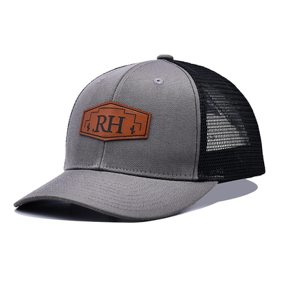 Aanpasbare katoenen truckerpet met leren patch op zweetband